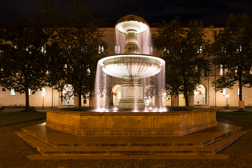 Illuminated fountain in downtown Munich, Germany