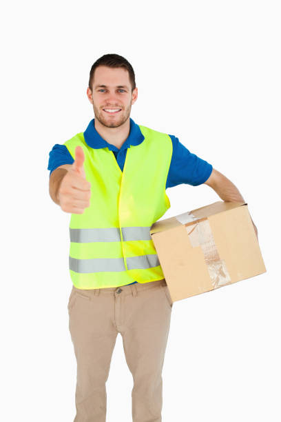 istock Smiling young delivery man giving approval 848146054