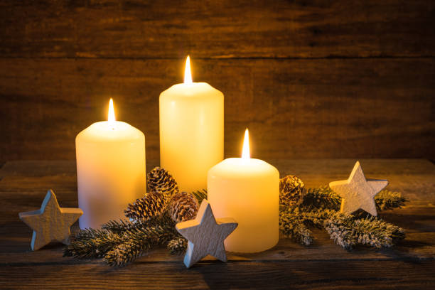istock Christmas composition with burning white candles and stars ornaments 848149730