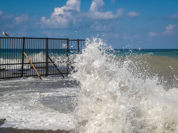 istock High wave with cloud of splash on beach in Sochi 848149856