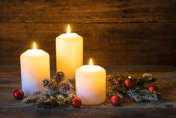 istock Festive burning white Christmas candles 848149958