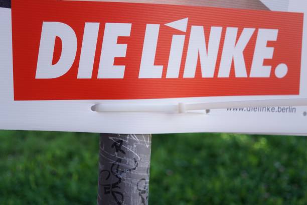 Election campaign billboard of German political party Die Linke Berlin, Germany - August 12, 2017: Election campaign billboard of German political party Die Linke. The Left Party is a democratic socialist and left-wing populist political party in Germany left wing politics stock pictures, royalty-free photos & images