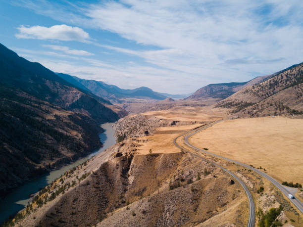 istock Aerial shot above blue river in grassland canyon 848170046