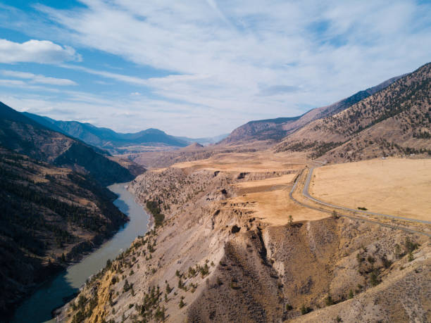 istock Aerial shot above blue river in grassland canyon 848170048