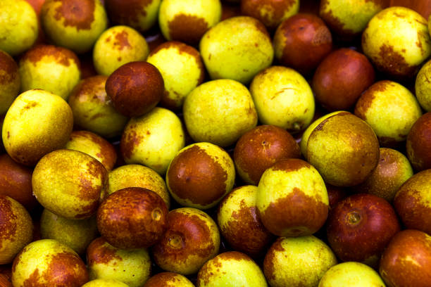 istock brown and green jujube fresh fruit background 848174064