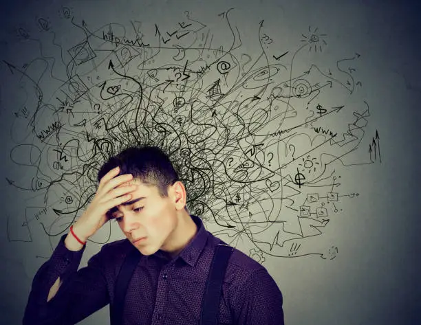 Photo of Thoughtful stressed man with a mess in his head