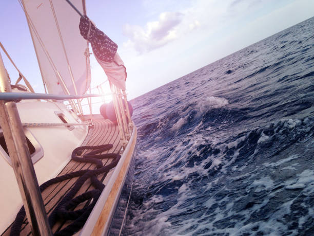 Yacht sailing on the sea, side view,waves, mobile stock