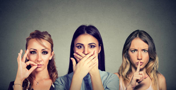 istock Keep a secret be quiet concept. Three secretive women keeping mouth shut. 848184598