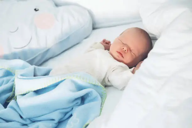 Newborn baby sleep first days of life. Cute little newborn child sleeping peacefully