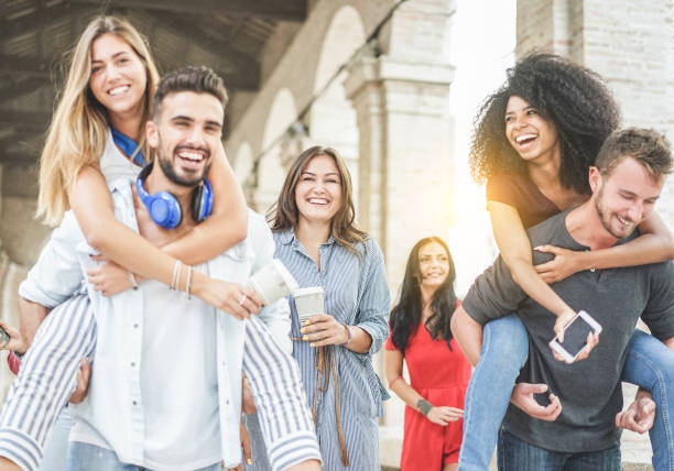 istock Young friends having fun in old city center - Happy students at university break laughing togehter - Youth, school and friendship concept - Focus on center woman holding coffee paper cup - Warm filter 848195708
