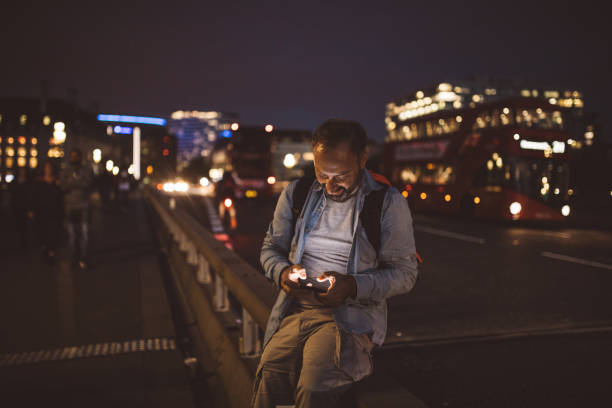istock Tourist man texting on the street 848196376