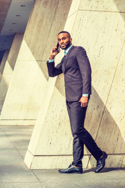 istock Young Businessman talking on cell phone outside in New York 848206052