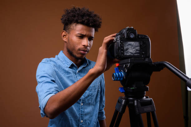 istock Studio shot of young handsome African man getting ready for vlogging against colored background 848206538