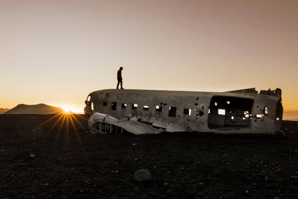 istock Men standing on Airplane Wreck - Solheimasandur Iceland 848209058