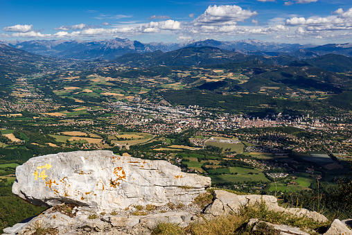 Elevated view of the city of Gap and region from Charance Peak in Summer. Hautes-Alpes, PACA Region, Southern French Alps, France