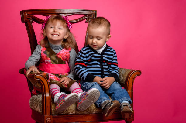 istock two children smiling wearing cowboy hats 848213222