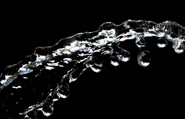 istock stream of water on a black background 848221186