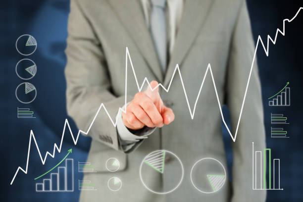 istock Man in suit pointing a curve on touch screen 848222614