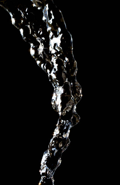 istock stream of water on a black background 848226180