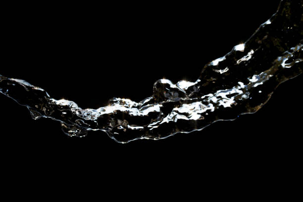 istock stream of water on a black background 848226454