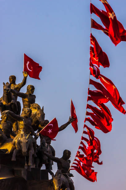 istock Turkish flags waving in the wind from statue 848230546