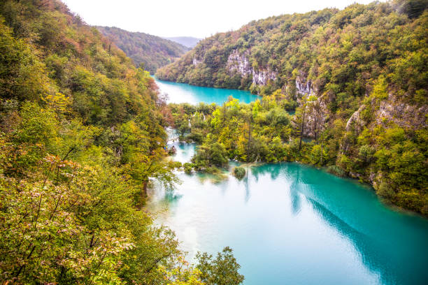 istock Waterfall in forest. Crystal clear water. wooden walk path, Plitvice lakes, Croatia 848231462
