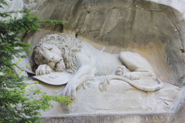 Lion of monument in Lucerne, Switzerland Inscription to commemorate for brave soldiers.