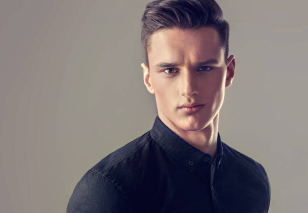 istock Handsome yong man dressed in a stylish  full buttoned black shirt . 848241826