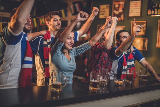 istock Friends watching game in bar 848245090