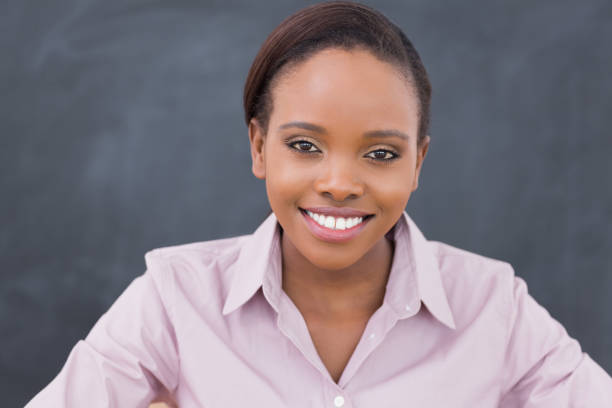 istock Front view of a teacher looking at camera 848261302
