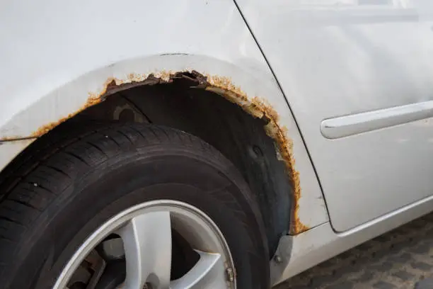 Photo of Rusty car wing.