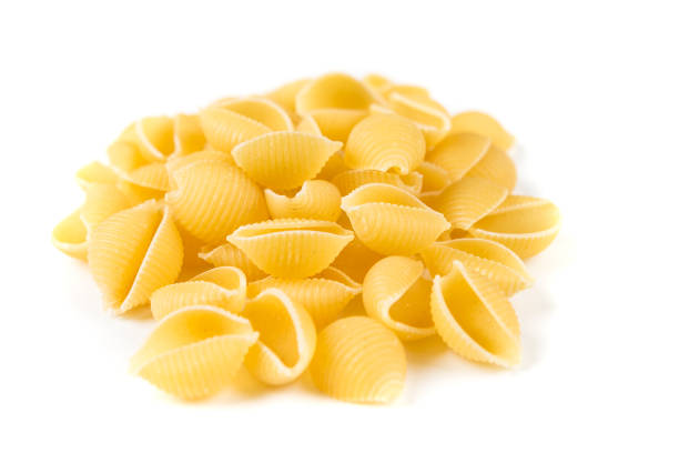 istock Pile of shell pasta isolated on a white background 848289920