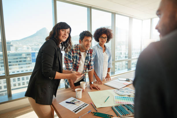 istock Team brainstorming over new designs in office 848290020