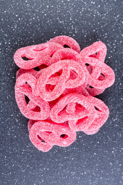 istock Fruit flavored jelly pretzel on a black background 848291392