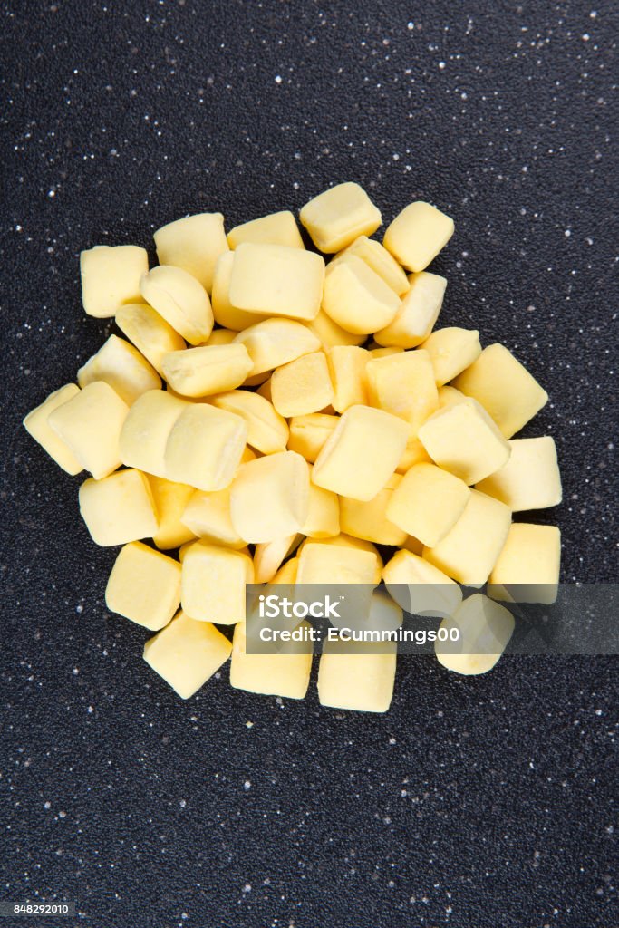 Square Yellow Mints Pile Of Yellow Mints On A Black Background Stock Photo - Download Image ...