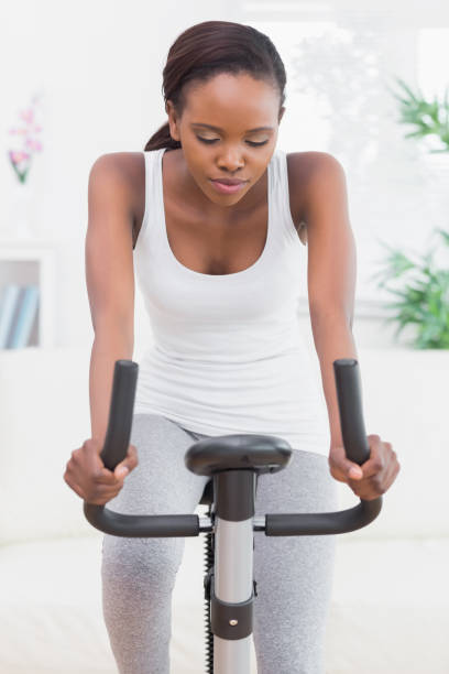 istock Woman doing exercise bike 848292682