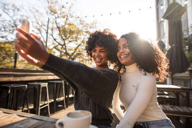 istock Two happy women having fun taking a selfie 848292862