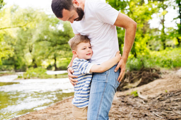 istock Young father with little boy, sunny spring day. 848297238