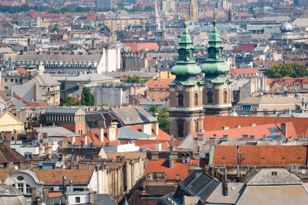 View over the rooftops of Budapest in Hungary with the towers of the University Church rise above the rest.