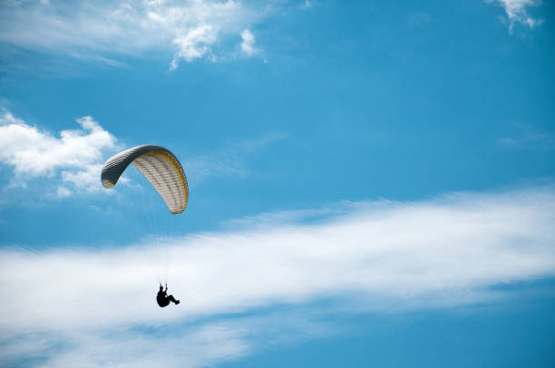 istock Paragliding in the sky on a sunny summer day. 848304372