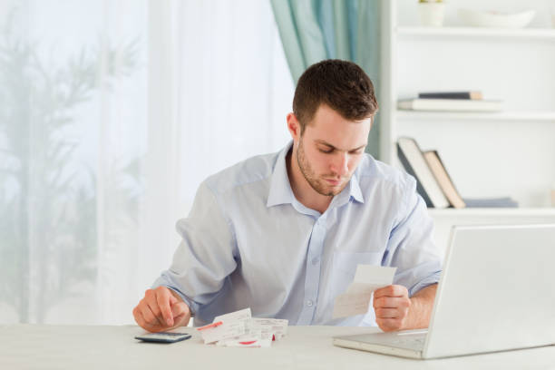 istock Businessman calculating his expenses 848308526