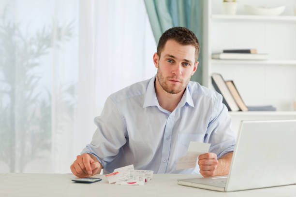 istock Businessman checking bills in his homeoffice 848308556