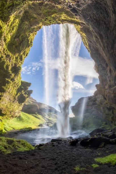 istock Kvernufoss Waterfall at Summer with blue sky in Iceland 848348518