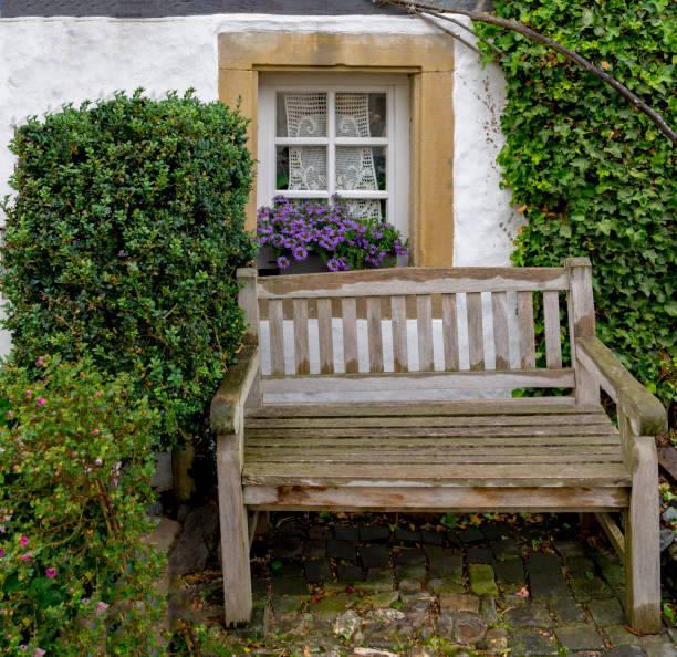istock Romantic bench in front of a half-timbered house window 848348536