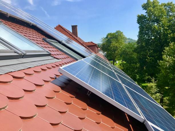 istock House roof with solar panels on top 848348614