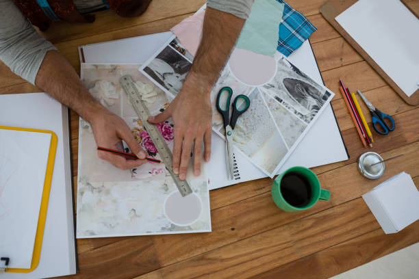 istock Cropped hands of designer drawing line on paper in office 848348630