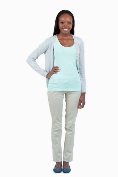 istock Smiling young woman with hand on her hip 848349334