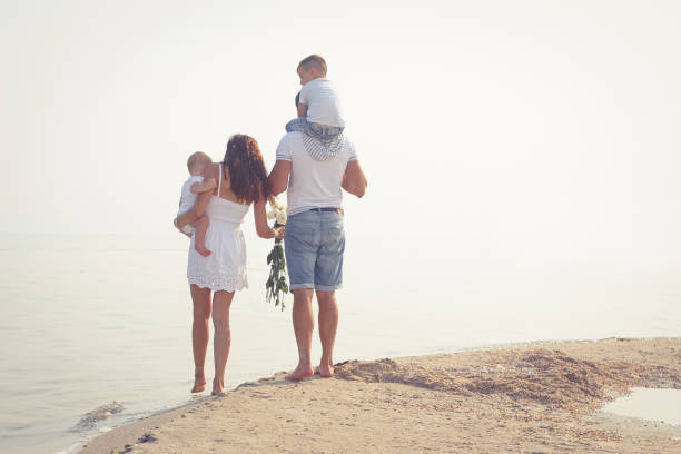 istock Young Family on the beach 848352276