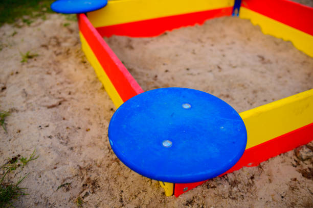 istock A nice sandbox playground filled . Surrounded by green grass, 848359124