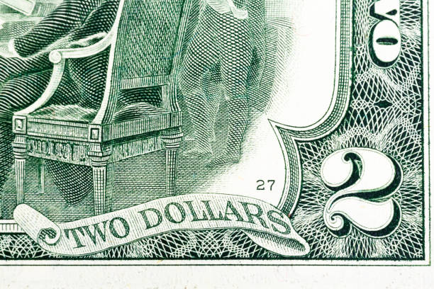 istock Fragment of two dollar bill. Macro shot 848363364
